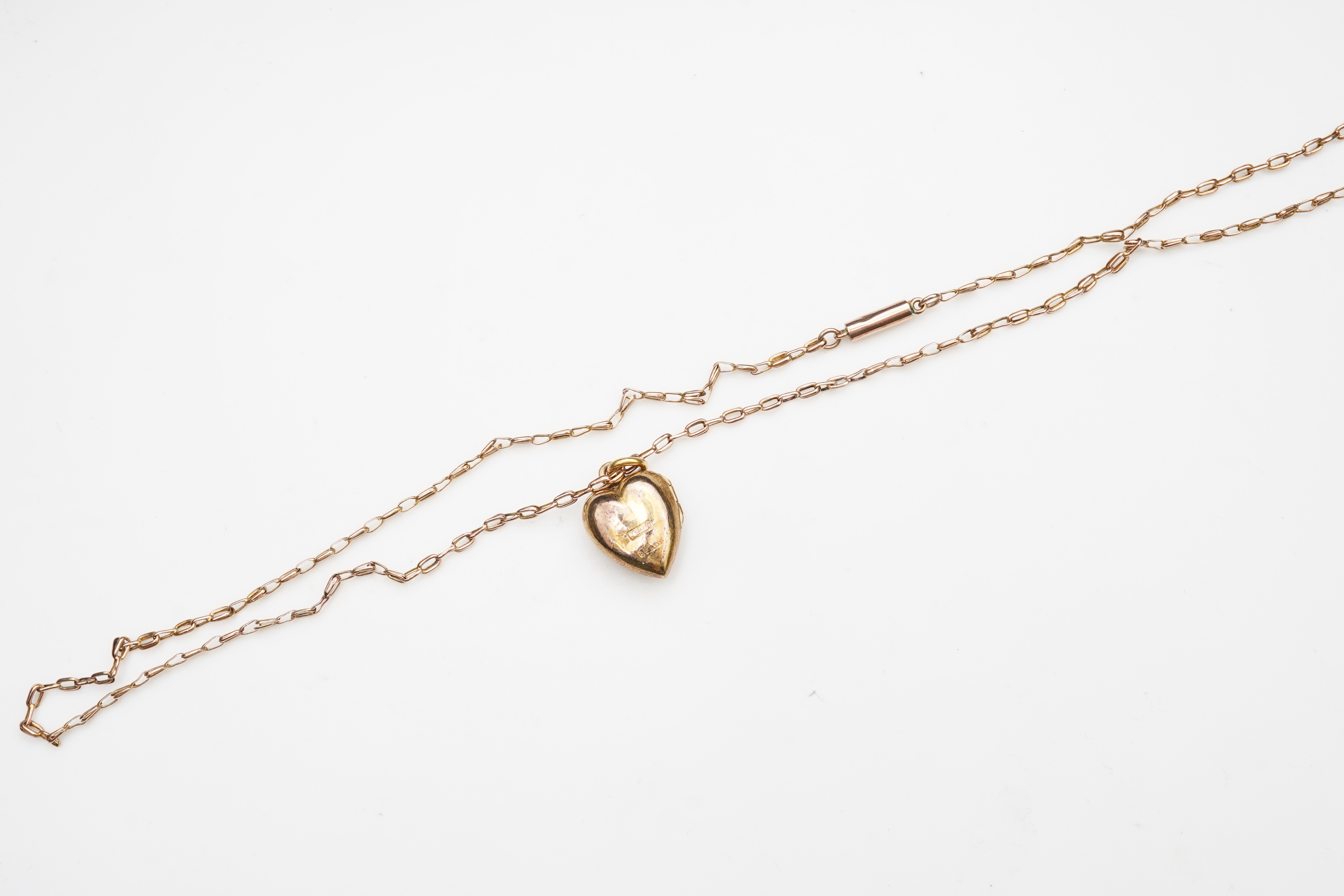 A ruby, sapphire and diamond locket pendant, early 20th century